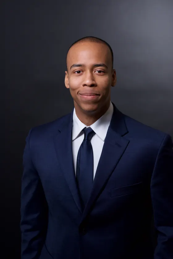 Team headshot on a charcoal backdrop